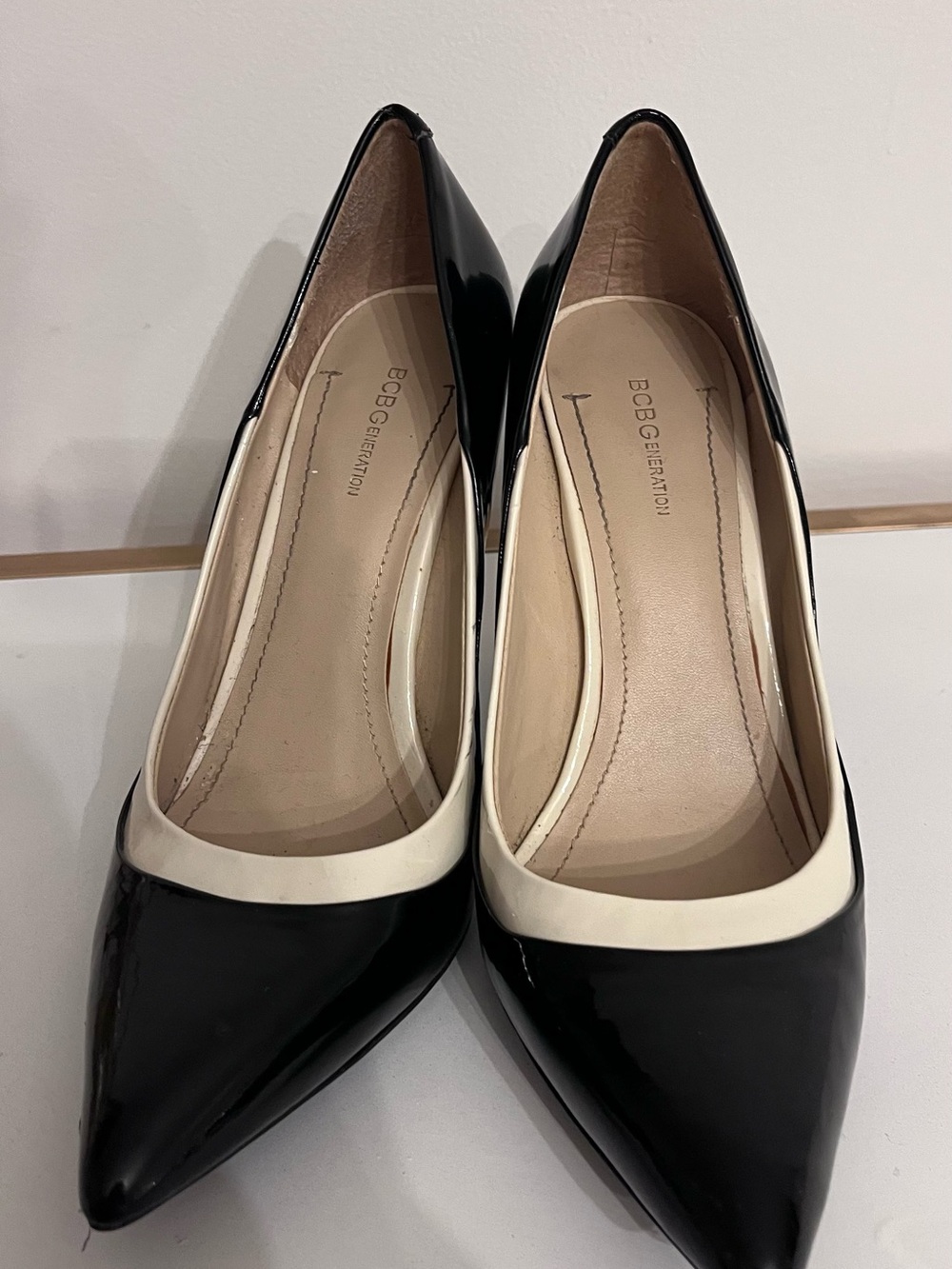 BCBGeneration Black and Cream Pointed Toe Patent Pumps